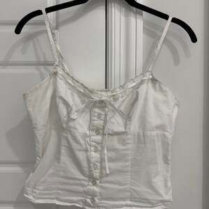 A. Hearts White Lace Trim Button Front Corset Cami Top